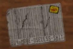 ステッカーを拡大したところ。バーコードの下に「BUY MORE USELESS SHIT」とはっきり書かれている