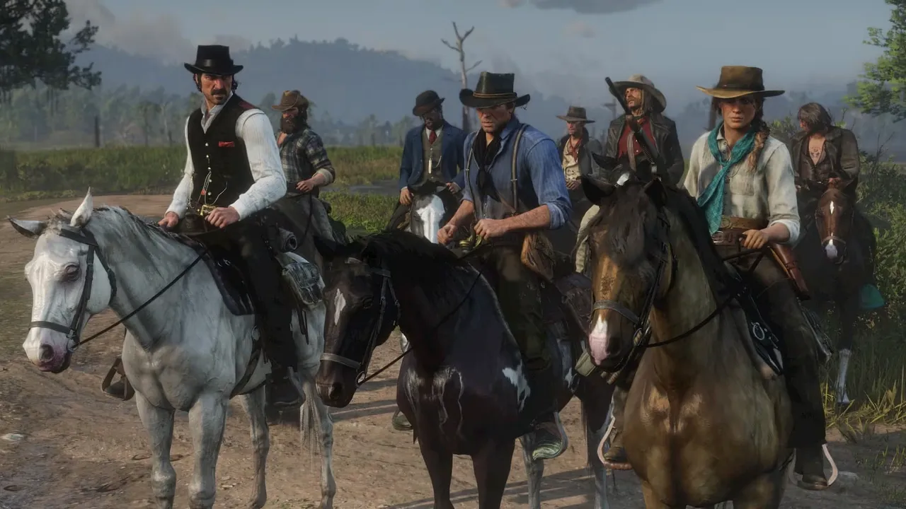 馬に乗ったギャングの一団が並んでこちらへ向かってくる『Red Dead Redemption 2』の公式スクリーンショット