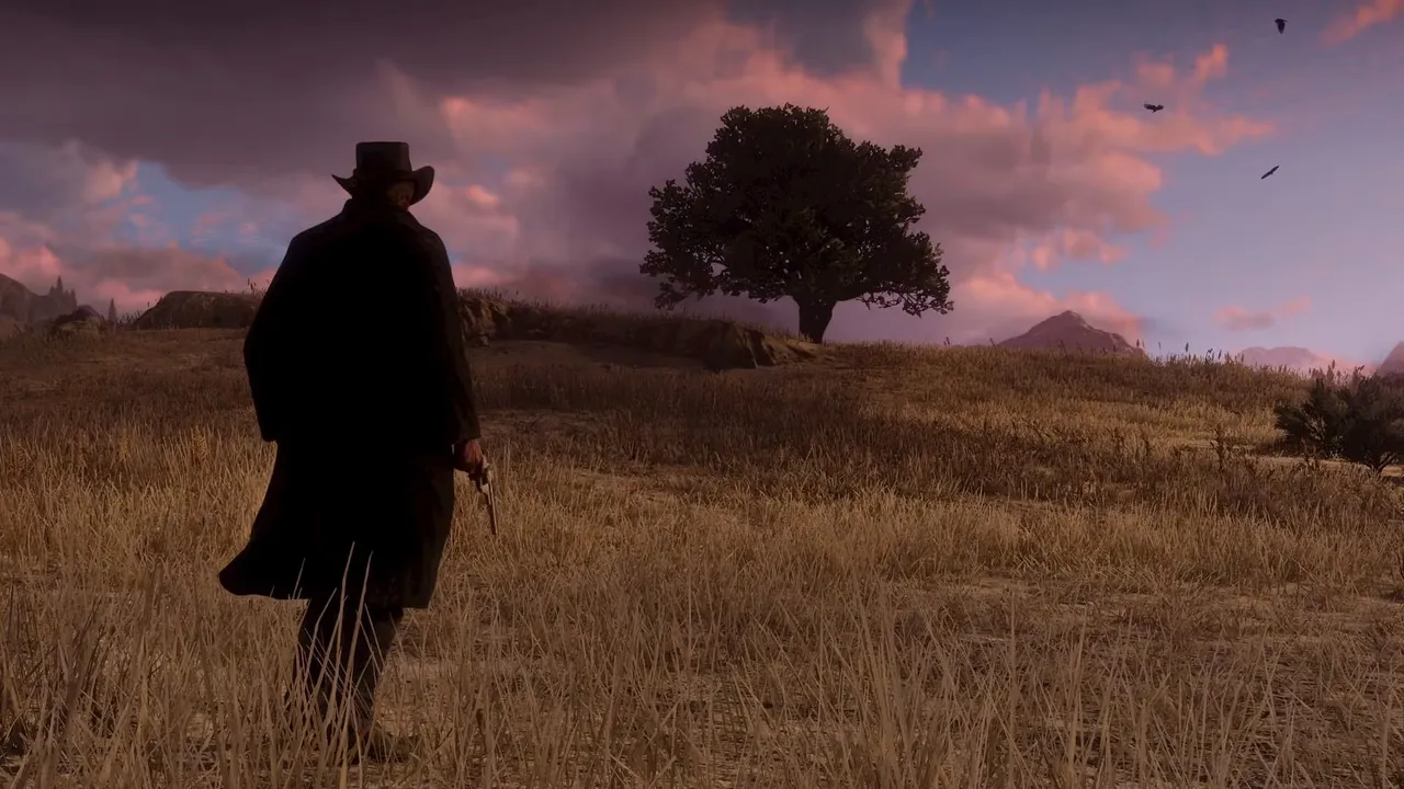 夕暮れの草原を、ロングコートの人物が1人で歩いていく『Red Dead Redemption 2』の公式スクリーンショット